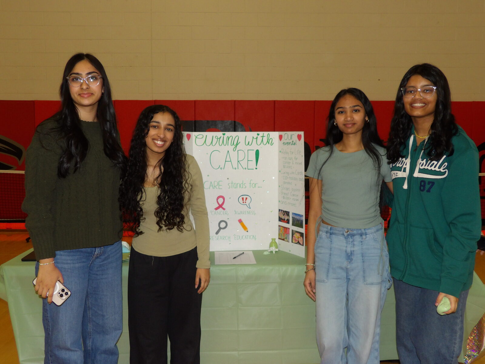 Students staffing the curingwithCARE Robbinsville nonprofit booth.